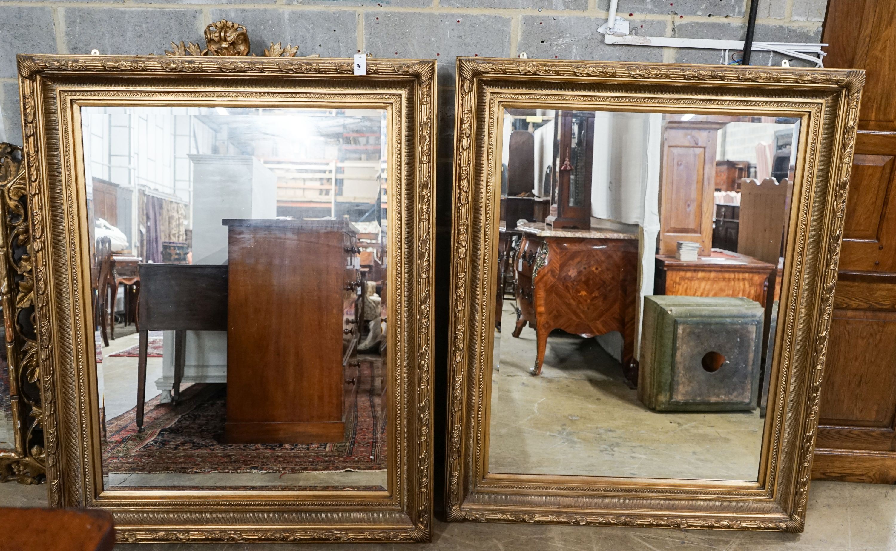 A pair of Victorian style rectangular gilt framed wall mirrors, width 118cm, height 150cm